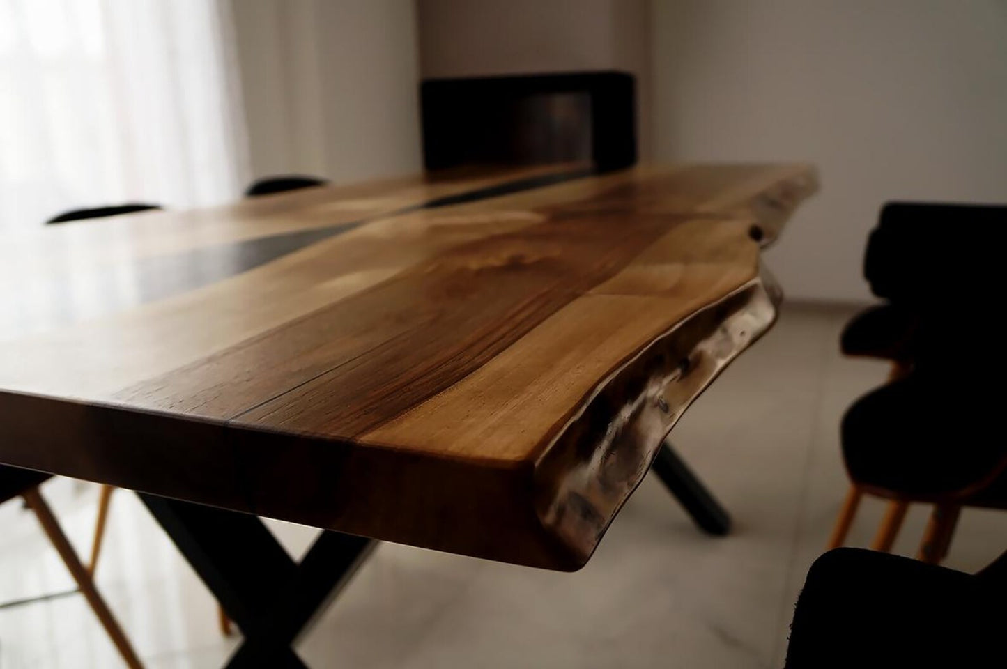 Black Epoxy River on a Walnut Live Edge Dining Table