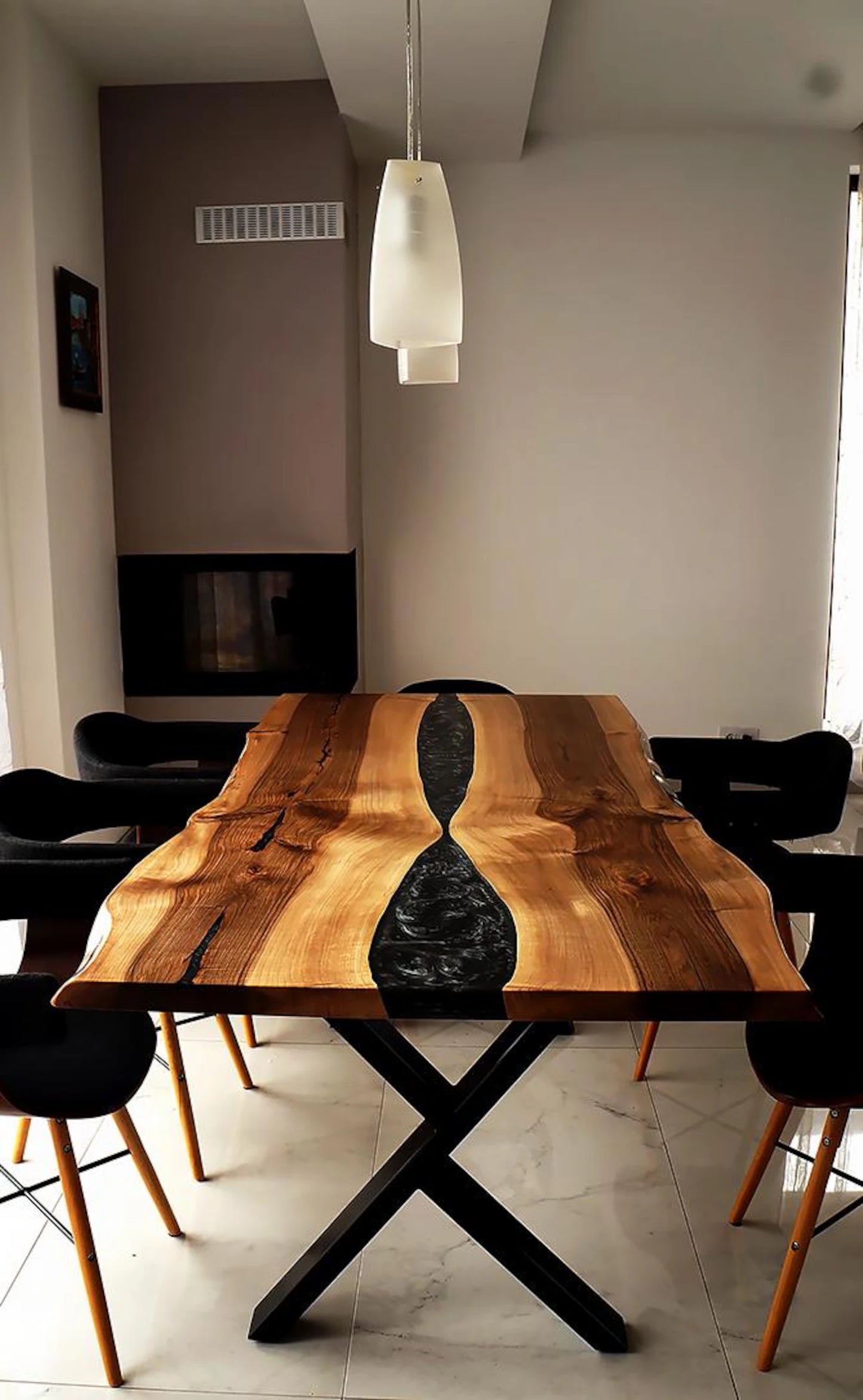 Black Epoxy River on a Walnut Live Edge Dining Table