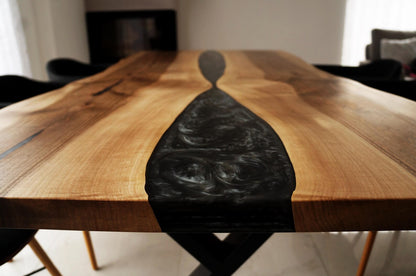 Black Epoxy River on a Walnut Live Edge Dining Table